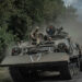 FILE PHOTO: Ukrainian servicemen ride a military vehicle, amid Russia's attack on Ukraine, near the Russian border in Sumy region, Ukraine August 10, 2024. REUTERS/Viacheslav Ratynskyi/File Photo