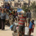 Displaced Palestinians make their way, as they flee Hamad City following an Israeli evacuation order, amid the Israel-Hamas conflict, in Khan Younis in the southern Gaza Strip, August 16, 2024. REUTERS/Hatem Khaled