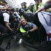 Demonstrators clash with police near the Israeli Consulate during the Democratic National Convention Tuesday, Aug. 20, 2024, in Chicago. (AP Photo/Julio Cortez)