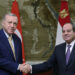 This handout photograph taken and released by Turkish Presidency Press Office on February 14, 2024, shows Turkish President Recep Tayyip Erdogan (L) shaking hands with his Egyptian counterpart Abdel Fattah al-Sisi (R) during an official visit to Egypt. (Photo by TURKISH PRESIDENTIAL PRESS SERVICE / AFP) / RESTRICTED TO EDITORIAL USE - MANDATORY CREDIT "AFP PHOTO / TURKISH PRESIDENCY PRESS OFFICE" - NO MARKETING NO ADVERTISING CAMPAIGNS - DISTRIBUTED AS A SERVICE TO CLIENTS