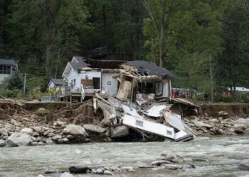 Damaged structures are seen in downtown Chimney Rock, North Carolina, October 2, 2024, after the passage of Hurricane Helene. The death toll from powerful storm Helene, which battered the southeastern United States, has climbed to more than 155, authorities said on October 1, as President Joe Biden and Vice President Kamala Harris surveyed the damage. (Photo by Allison Joyce / AFP)