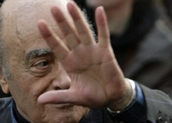 Mohamed Al Fayed leaves the Royal Courts of Justice in central London, on February 18, 2008. Princess Diana and her boyfriend Dodi Fayed were murdered, his father claimed Monday, saying she had voiced fears that senior royals were trying to "get rid" of her. Testifying for the first time at the coroner's inquest into the couple's death, Mohamed Al Fayed pointed the finger firmly at Prince Charles and Queen Elizabeth II's husband Prince Philip, whom he called a "Nazi" and a "racist". AFP PHOTO/LEON NEAL (Photo by LEON NEAL / AFP)