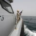 A Saudi border guard watches as he stands in a boat off the coast of the Red Sea on Saudi Arabia's maritime border with Yemen, near Jizan April 8, 2015. Iran sent two warships to the Gulf of Aden on Wednesday, state media reported, establishing a military presence off the coast of Yemen where Saudi Arabia is leading a bombing campaign to oust the Iran-allied Houthi movement. REUTERS/Faisal Al Nasser