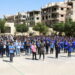 Students gesture as they stand together at the playground of Mleiha rural school, in Mleiha, Syria, September 14, 2021. Picture taken September 14, 2021. REUTERS/Firas Makdesi