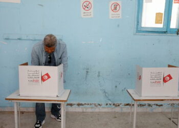 A man votes at a polling station during parliamentary election in Tunis, Tunisia December 17, 2022. REUTERS/Zoubeir Souissi