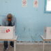 A man votes at a polling station during parliamentary election in Tunis, Tunisia December 17, 2022. REUTERS/Zoubeir Souissi