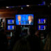 People watch the presidential debate between Republican presidential nominee and former U.S. President Donald Trump and Democratic presidential nominee and U.S. Vice President Kamala Harris at a watch party hosted by the New York Young Republican Club, in New York City, U.S., September 10, 2024. REUTERS/Adam Gray