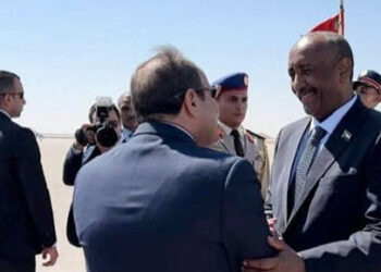 A handout image posted on the Sudanese Armed Forces' Facebook page shows army chief General Abdel Fattah al-Burhan (R) greeting Egyptian President Abdel Fattah al-Sisi after arriving in El Alamein on Egypt's northern coast, on August 29, 2023. Burhan and al-Sisi are expected to hold talks "on the latest developments in Sudan and bilateral ties between the two countries", the Sudanese Transitional Sovereignty Council said in a statement. (Photo by Sudanese Army / AFP) / RESTRICTED TO EDITORIAL USE - MANDATORY CREDIT "AFP PHOTO /  Sudanese Army Facebook Page  " - NO MARKETING NO ADVERTISING CAMPAIGNS - DISTRIBUTED AS A SERVICE TO CLIENTS