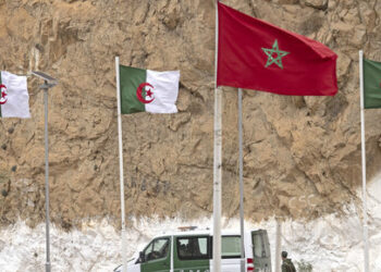 A picture taken from the Moroccan region of Oujda shows Algerian border guards patrolling along the border with Morocco on November 4, 2021. Algeria has accused its arch-rival Morocco of killing three Algerians on a desert highway, as tensions escalate between the neighbours over the contested Western Sahara. (Photo by FADEL SENNA / AFP)