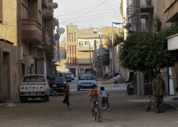 Libyan children play on the streets of the rebel-held Benghazi, Libya, Sunday, July 10, 2011. Since the uprising against Gadhafi's 42-year rule broke out in February, armed rebels saying they seek democracy have seized much of the country's east, where they've set up an administration in the city of Benghazi. (AP Photo/Sergey Ponomarev)