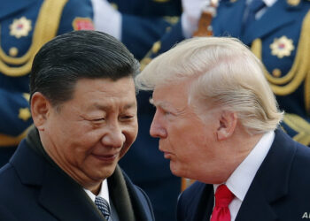 FILE - In this Nov. 9, 2017, file photo, U.S. President Donald Trump, right, chats with Chinese President Xi Jinping during a welcome ceremony at the Great Hall of the People in Beijing. Trump has shaken up Asia, as he has much of the world. Now Beijing, Seoul and other Asian capitals are waiting to see if the Democrats wrest control of at least one house of Congress from the Republicans - and whether that would significantly alter U.S. foreign policy and trade initiatives. For China, the hope is he might be forced to ease off on trade. The world’s two biggest economies have been throwing escalating import tariffs at each other since March, unnerving global markets. (AP Photo/Andy Wong, File)