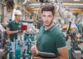 technician team while robot maintenance in a welding shop of a car manufacture