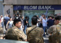 Members of the Lebanese army stand guard outside a Blom Bank branch in Beirut, Lebanon September 14, 2022. REUTERS/Mohamed Azakir