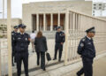 Moroccan policemen stand guard outside the tribunal of Rabat on April 13, 2023, during the trial of three men accused of repeatedly raping an 11-year-old girl. The lawyer for the 11-year-old Moroccan girl from a village near Rabat, raped repeatedly over a period of months and whose rapists received light sentences that outraged the country, urged authorities on April 13 to review laws protecting minors. (Photo by FADEL SENNA / AFP)