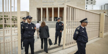 Moroccan policemen stand guard outside the tribunal of Rabat on April 13, 2023, during the trial of three men accused of repeatedly raping an 11-year-old girl. The lawyer for the 11-year-old Moroccan girl from a village near Rabat, raped repeatedly over a period of months and whose rapists received light sentences that outraged the country, urged authorities on April 13 to review laws protecting minors. (Photo by FADEL SENNA / AFP)