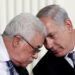 FILE PHOTO: Israeli Prime Minister Benjamin Netanyahu (R) and Palestinian President Mahmoud Abbas speak during an event about the Middle East peace talks in the East Room at the White House in Washington September 1, 2010.   REUTERS/Jim Young   /File Photo