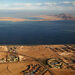 (FILES) This file photo taken on January 14, 2014 shows an aerial view of the Red Sea's Tiran (middle) and the Sanafir (background) islands in the Strait of Tiran between Egypt's Sinai Peninsula and Saudi Arabia at the mouth of the Gulf of Aqaba. - As US President Joe Biden visits the Middle East, one issue on the table will be the status of two the small Red Sea islands of Tiran and Sanfir that are uninhabited but of key strategic value. Resolving the tricky status that stems from their location and turbulent history would help build trust between Israel and Saudi Arabia, two US allies now taking gradual steps that Washington hopes could one day lead to diplomatic ties. (Photo by AFP)