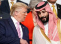 U.S. President Donald Trump speaks with Saudi Arabia's Crown Prince Mohammed bin Salman during family photo session with other leaders and attendees at the G20 leaders summit in Osaka, Japan, June 28, 2019.  REUTERS/Kevin Lamarque