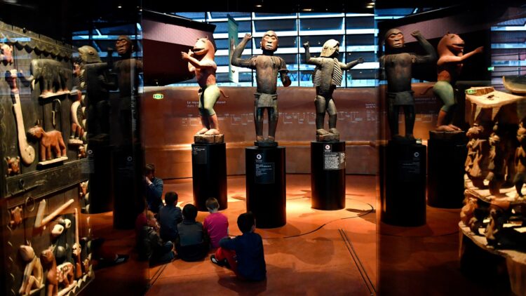Big royal statues from the Kingdom of Dahomey, in present-day Benin, are pictured in 2018 at the Quai Branly Museum in Paris.