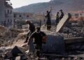 Rescue workers search for victims under the rubble of a building destroyed in an Israeli airstrike in the southern village of Kfar Rumman, Lebanon, Monday, Sept. 7, 2026. (AP Photo/Mohammed Zaatari)