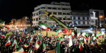TEHRAN, IRAN - APRIL 21: People gather at Enghelab and Vanak squares to participate in anti-US and anti-Israel demonstrations, waving Iranian flags and chanting slogans on April 21, 2026 in Tehran, Iran. During the ongoing protests, the Iranian Armed Forces displayed ballistic missiles at the demonstration areas. (Photo by Fatemeh Bahrami/Anadolu via Getty Images)