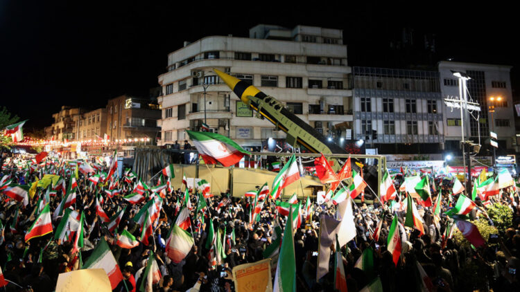 TEHRAN, IRAN - APRIL 21: People gather at Enghelab and Vanak squares to participate in anti-US and anti-Israel demonstrations, waving Iranian flags and chanting slogans on April 21, 2026 in Tehran, Iran. During the ongoing protests, the Iranian Armed Forces displayed ballistic missiles at the demonstration areas. (Photo by Fatemeh Bahrami/Anadolu via Getty Images)